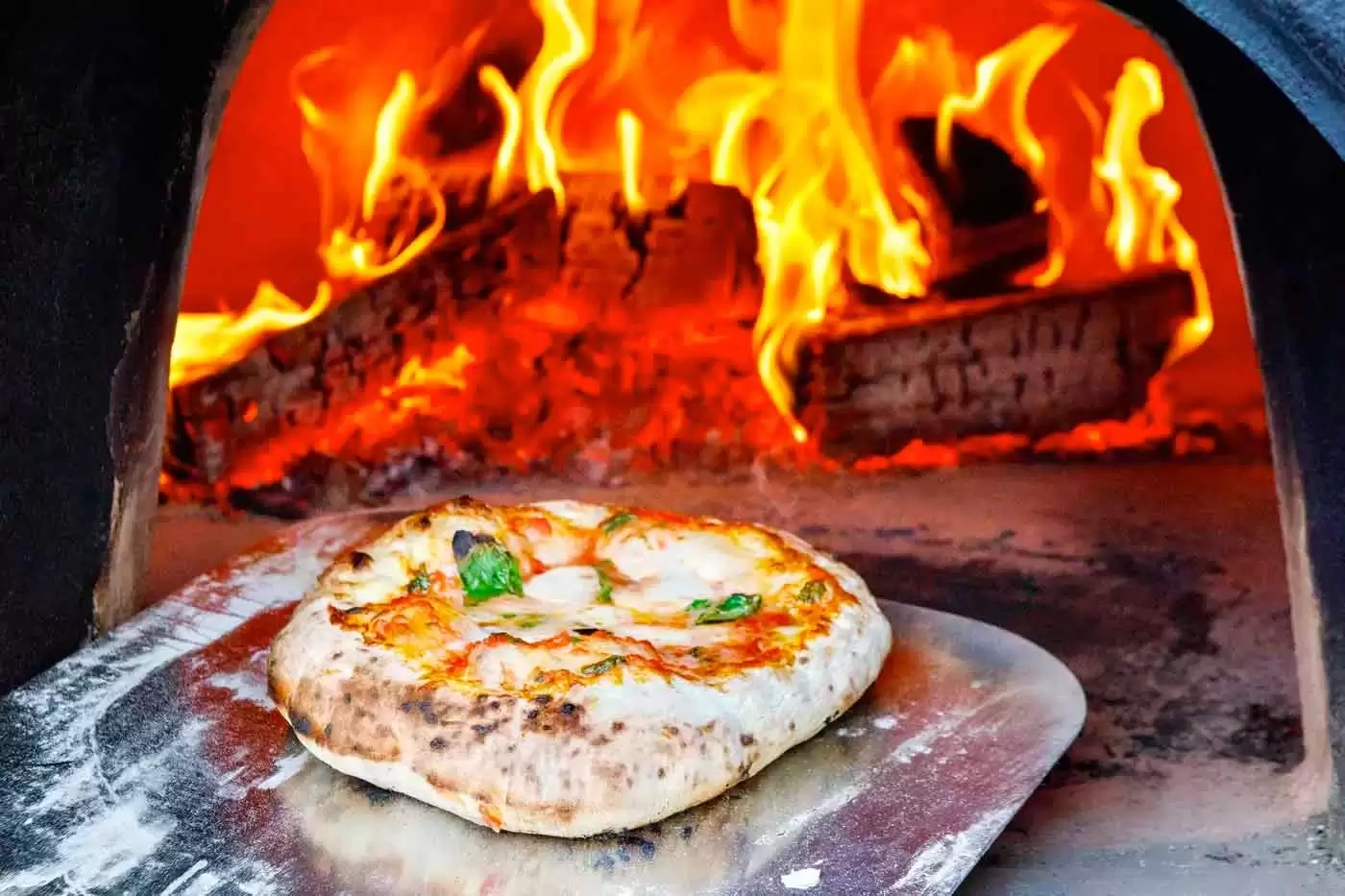 how to use a wood burning pizza oven